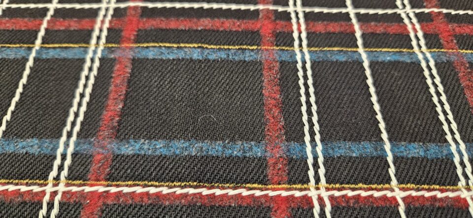 Denim Agugliato con motivo tartan e trapunti